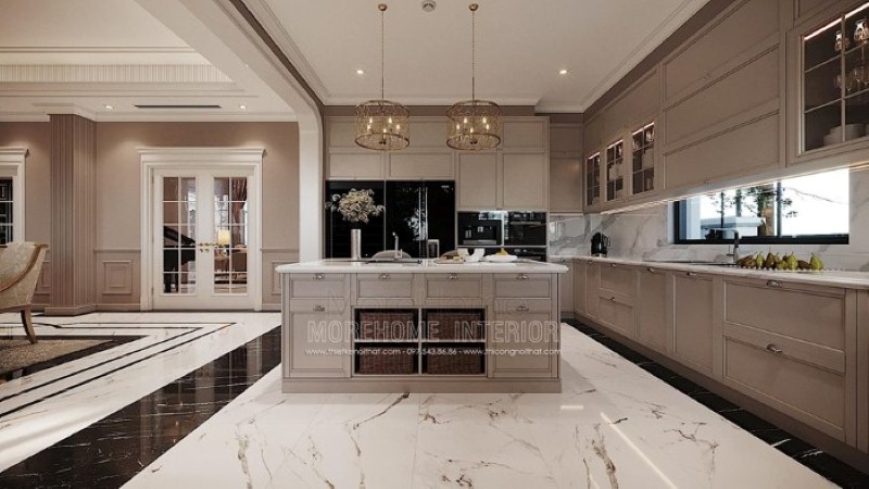 Bàn đảo bếp tân cổ điển ốp đá đẹp sang trọng với thiết kế nhiều hộc tủ cùng các ô mở giúp không gian trở nên linh động, tiện nghi. thiết kế thi công nội thất cao cấp