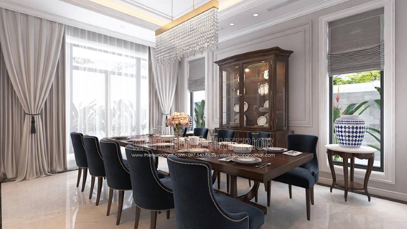 Bố trí nội thất phòng ăn gỗ óc chó tân cổ điển đẹp, sang trọng từ bàn gỗ nguyên khối, ghế bọc nệm cao cấp, kệ, tủ kệ trang trí. thiết kế thi công nội thất biệt thự cao cấp